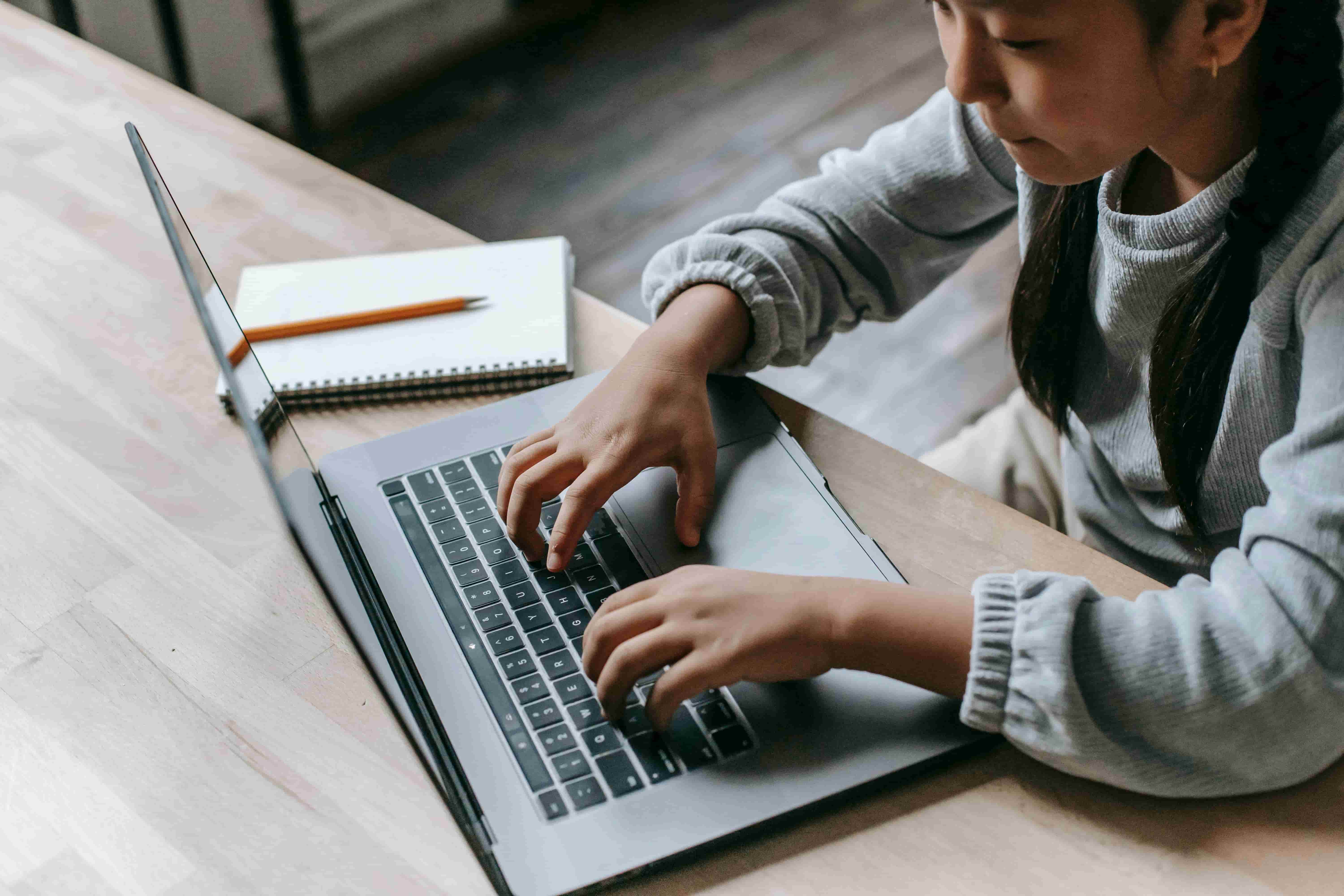 Woman working on the computer to pass the test