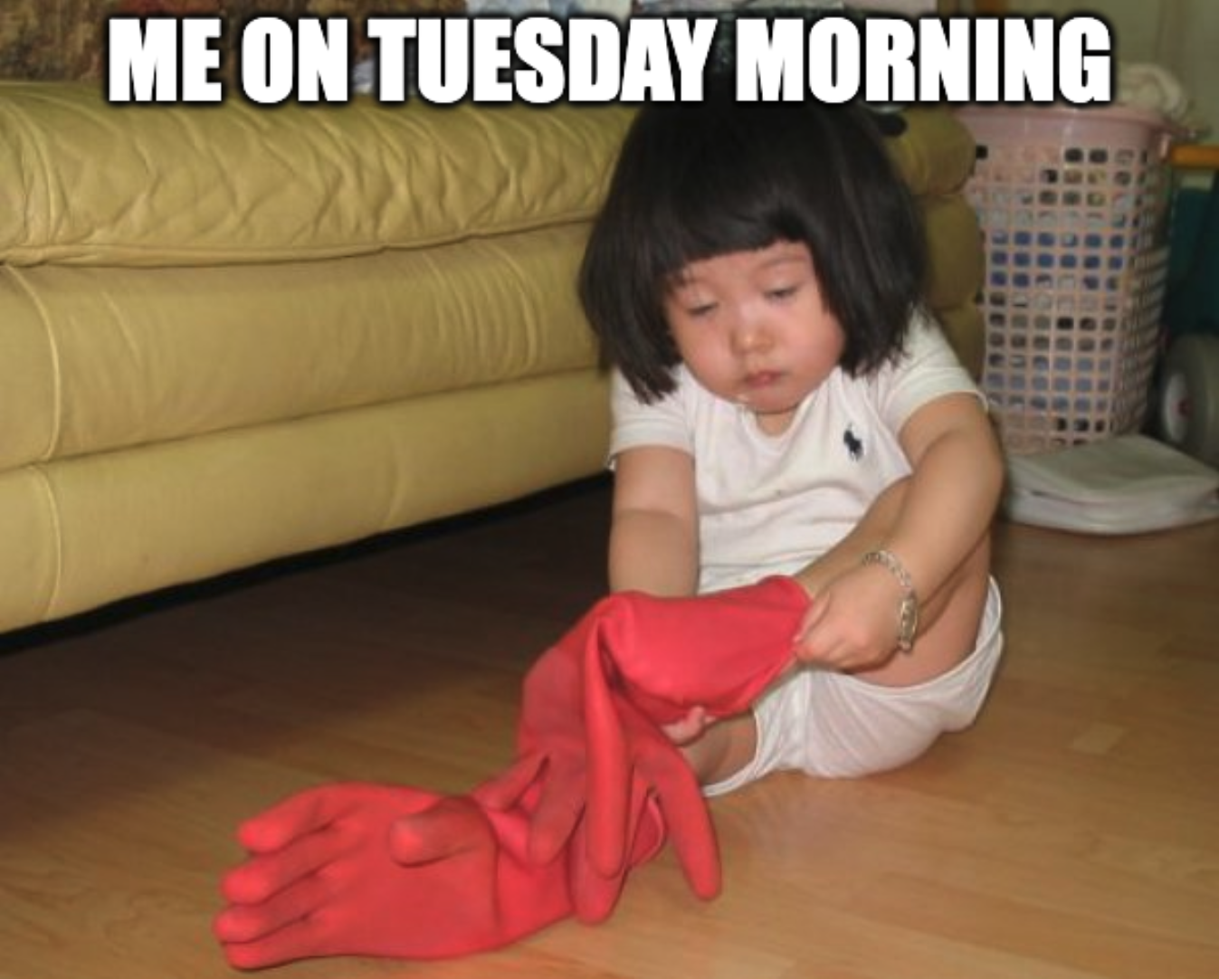 Baby tired and puts not socks on, but gloves