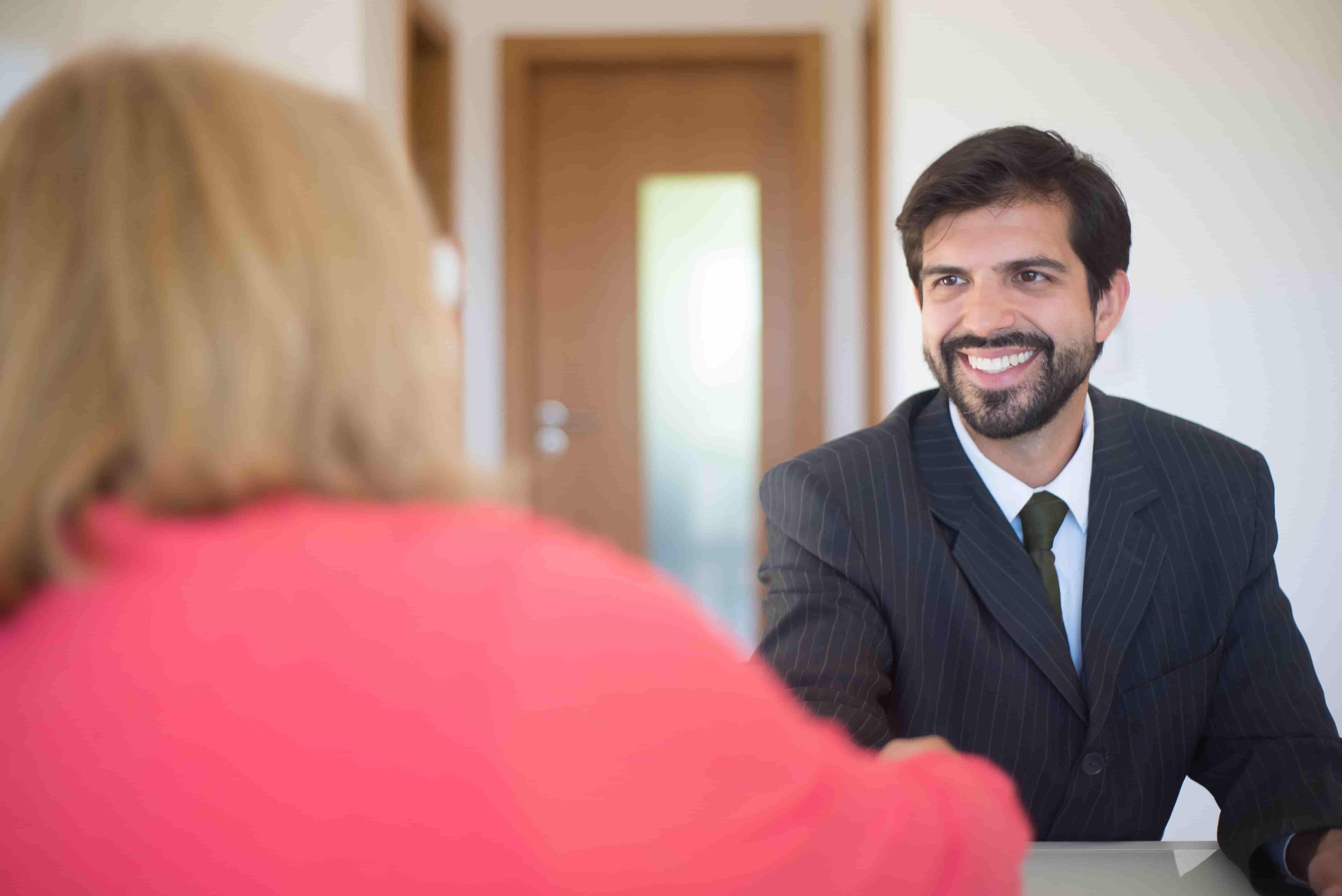 Confident smile after receiving praise in an interview