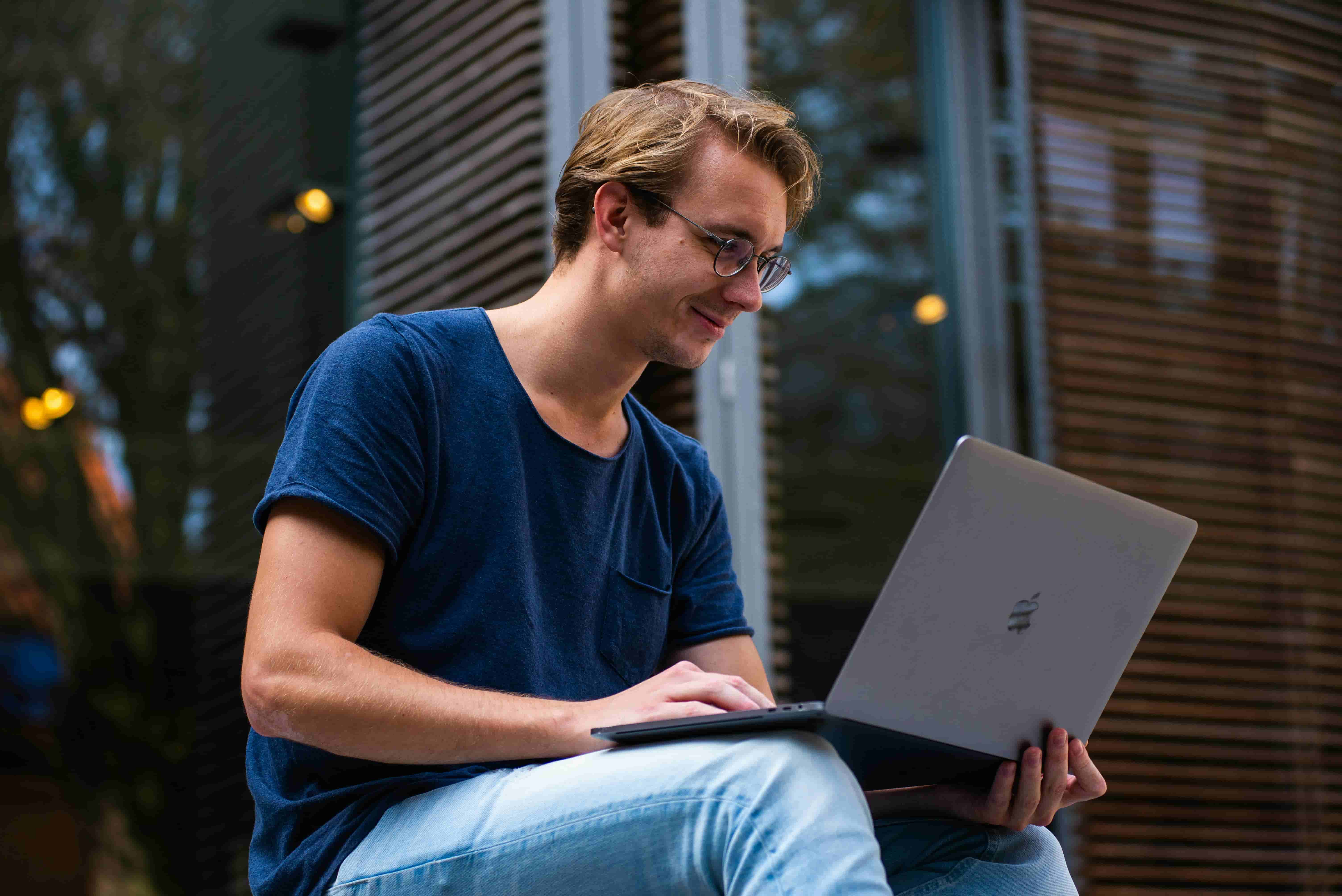 Person using a laptop illustrating blue light exposure