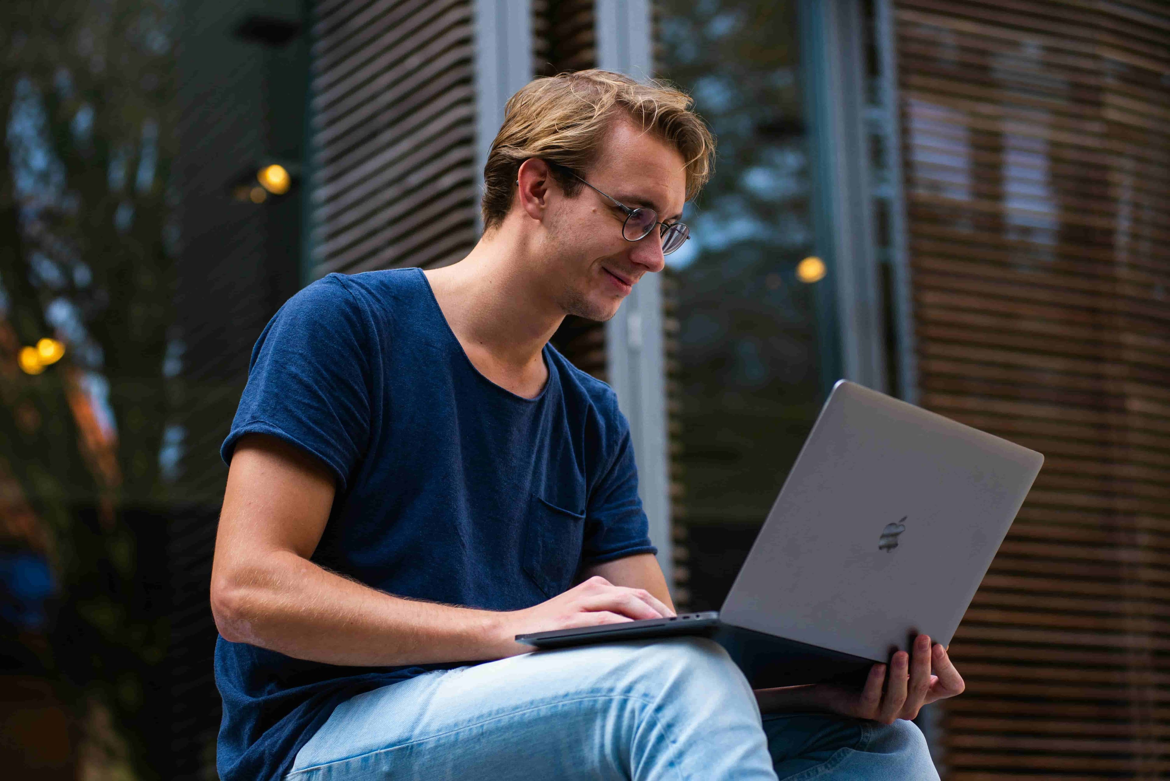 Person using a laptop illustrating blue light exposure