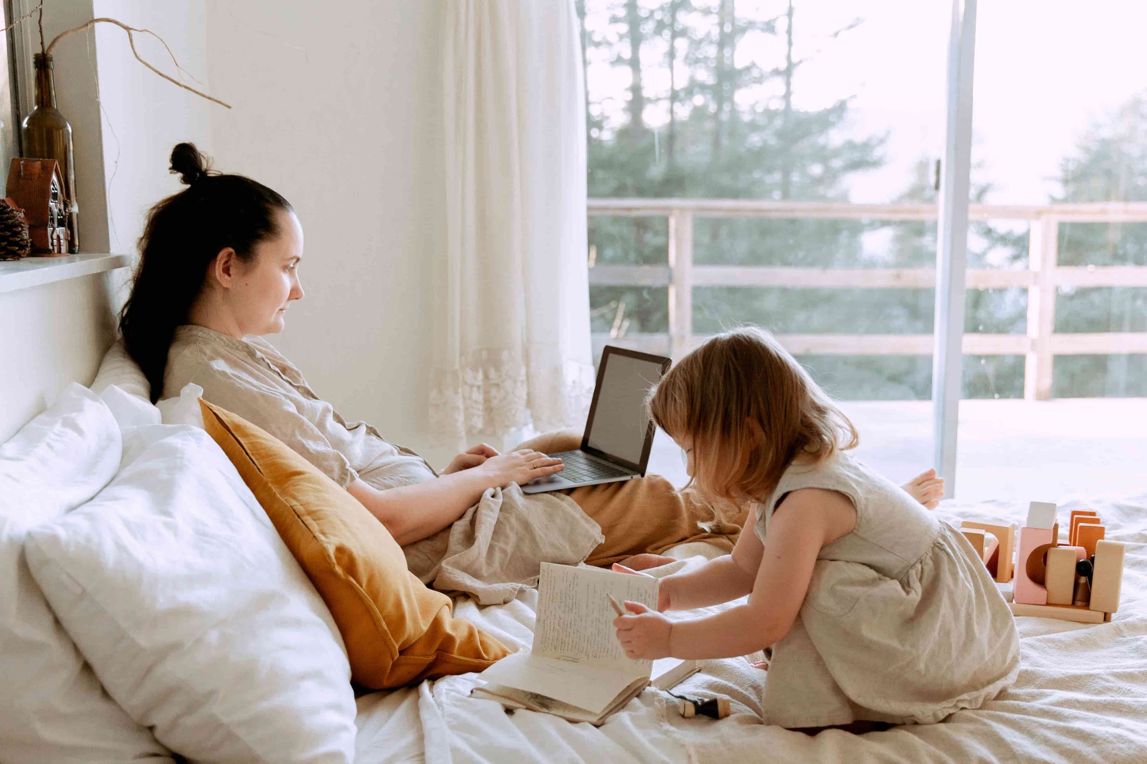 Mother with kid while working from home